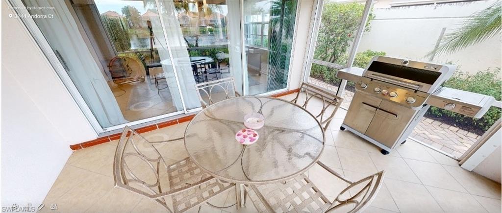 3144 Andorra Court Naples, FL 34109 - Photo 6 of 18 Sunroom / solarium with tile patterned flooring and healthy amount of natural light
