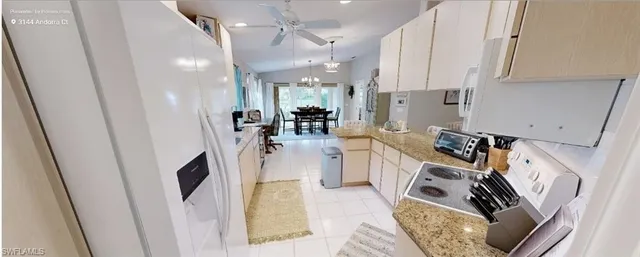 a view of a kitchen with appliances and cabinets