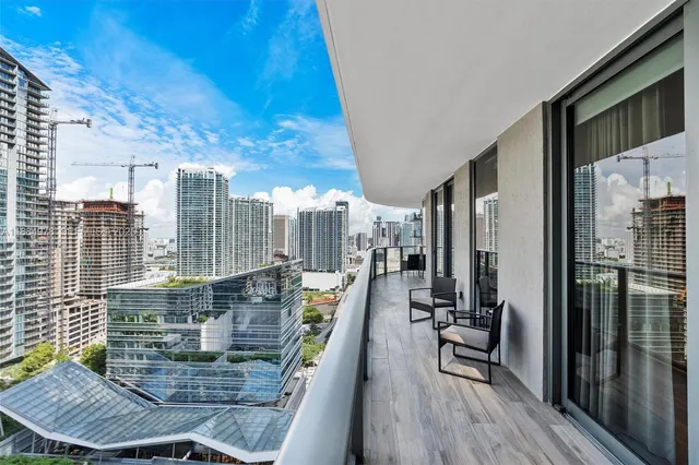 a very nice looking living room with a large window
