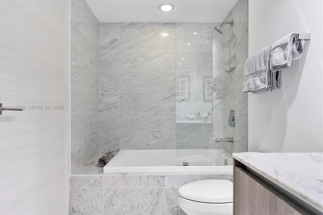 a bathroom with a bathtub and a sink