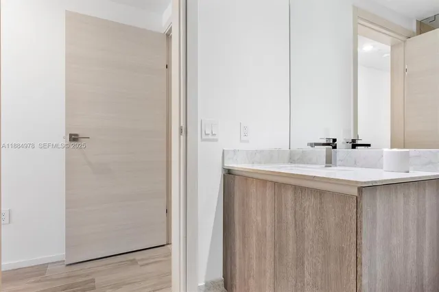 a kitchen with kitchen island a sink stove and refrigerator