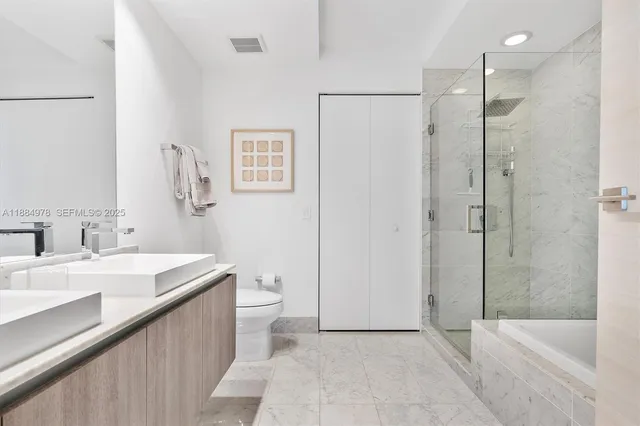 an aerial view of a multi story building with an outdoor space