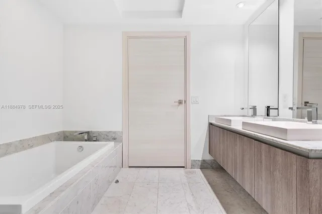 a front view of a multi story building with yard