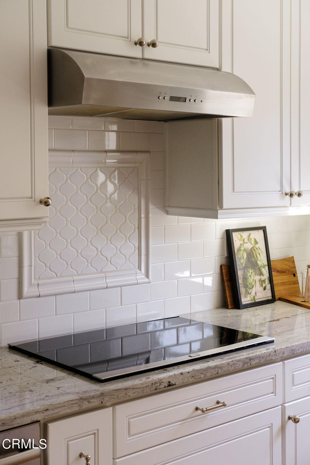 2242 Brigden Road Pasadena, CA 91104 - Photo 11 of 32 a sink and a stove with white cabinets