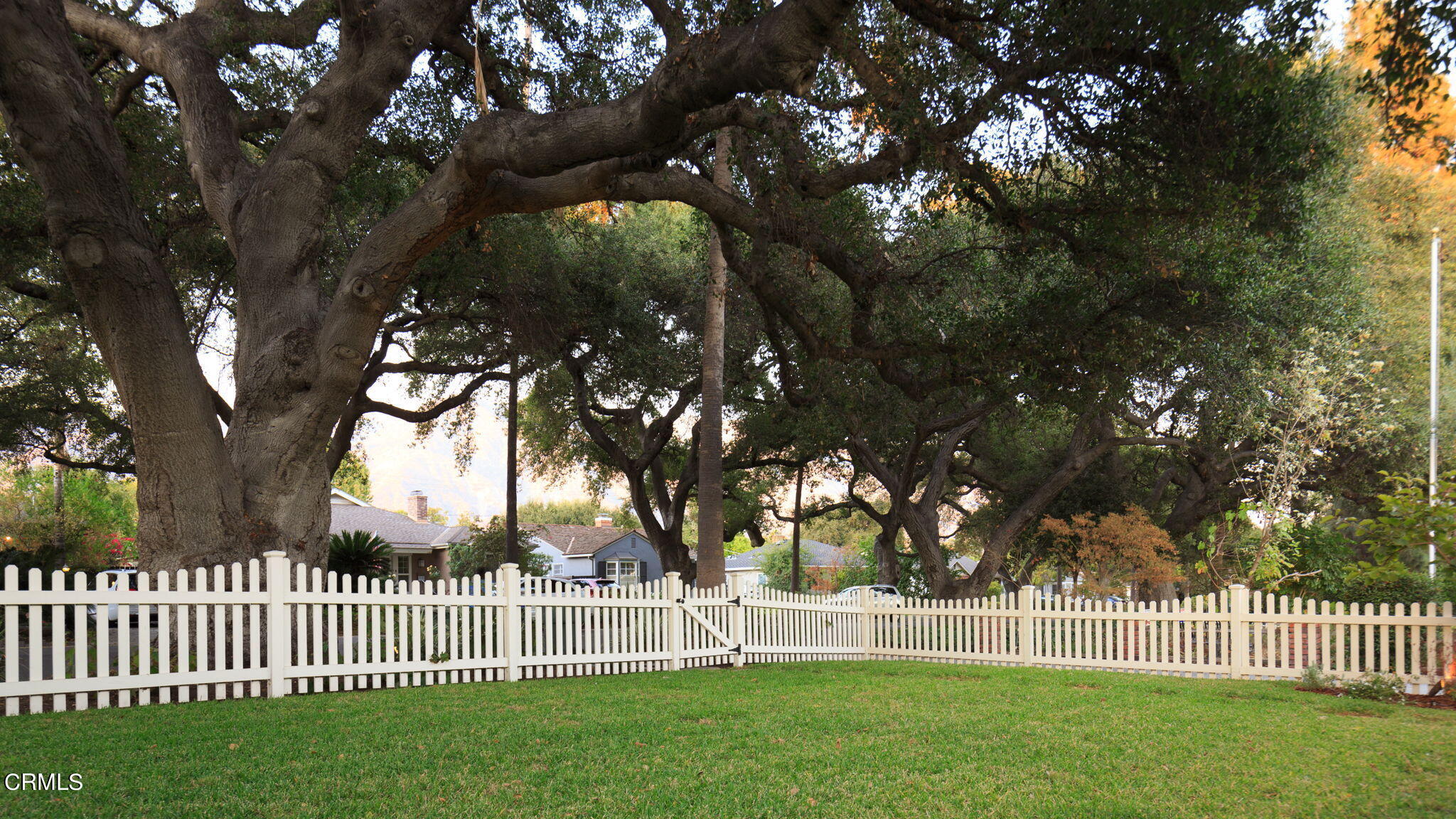 2242 Brigden Road Pasadena, CA 91104 - Photo 31 of 32 a view of a bench in a yard with wooden fence