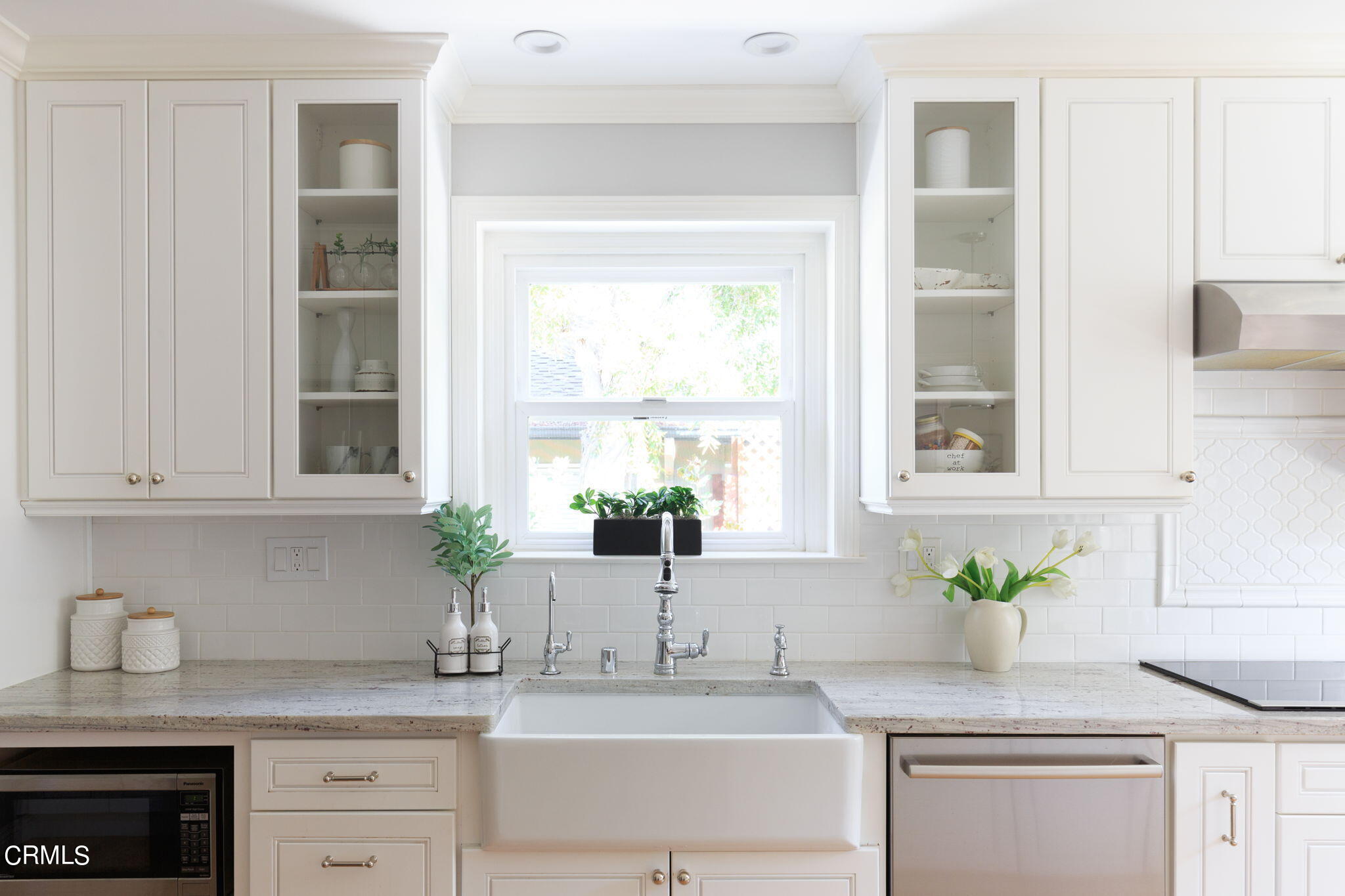 2242 Brigden Road Pasadena, CA 91104 - Photo 10 of 32 a kitchen with granite countertop white cabinets and a window