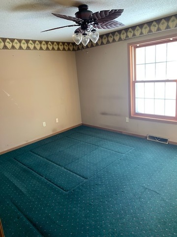 400 Wayne Road Rochelle, IL 61068 - Photo 7 of 9 a view of a room with window and a glass door