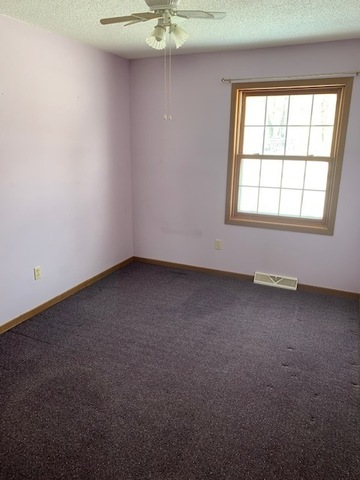 400 Wayne Road Rochelle, IL 61068 - Photo 8 of 9 an empty room with a window