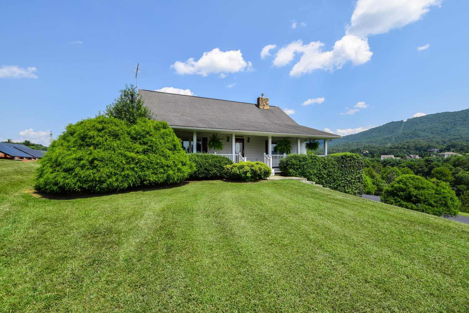 953 Webster Road Roanoke, VA 24012 - Photo 1 of 34 a front view of a house with a yard
