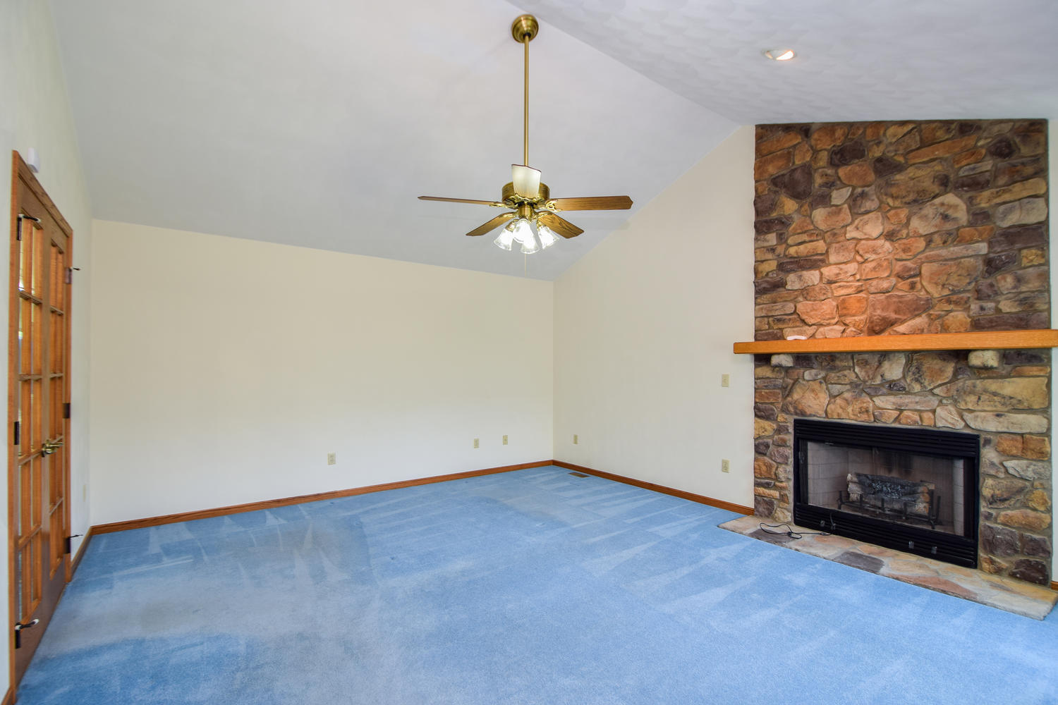 953 Webster Road Roanoke, VA 24012 - Photo 11 of 34 a view of a room with a ceiling fan and a fireplace
