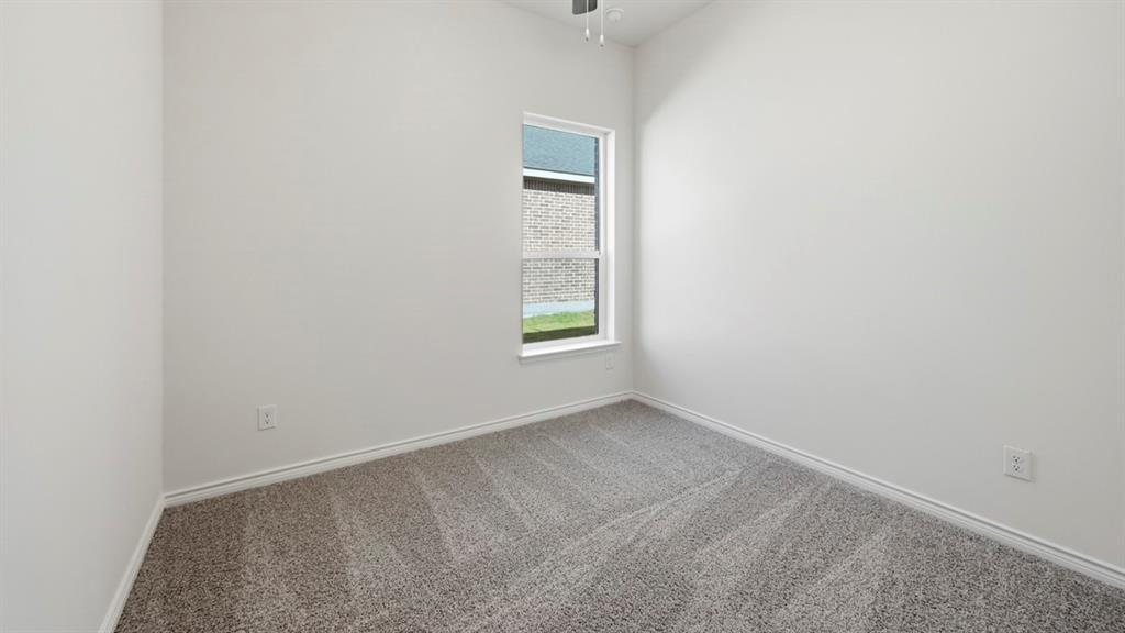 4163 Waldron Trail Forney, TX 75126 - Photo 28 of 30 Carpeted room featuring a single window, white walls, and a ceiling fan