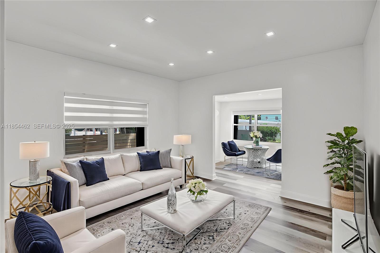 2137 Southwest 4th Street Miami, FL 33135 - Photo 1 of 27 a living room with furniture and a large window