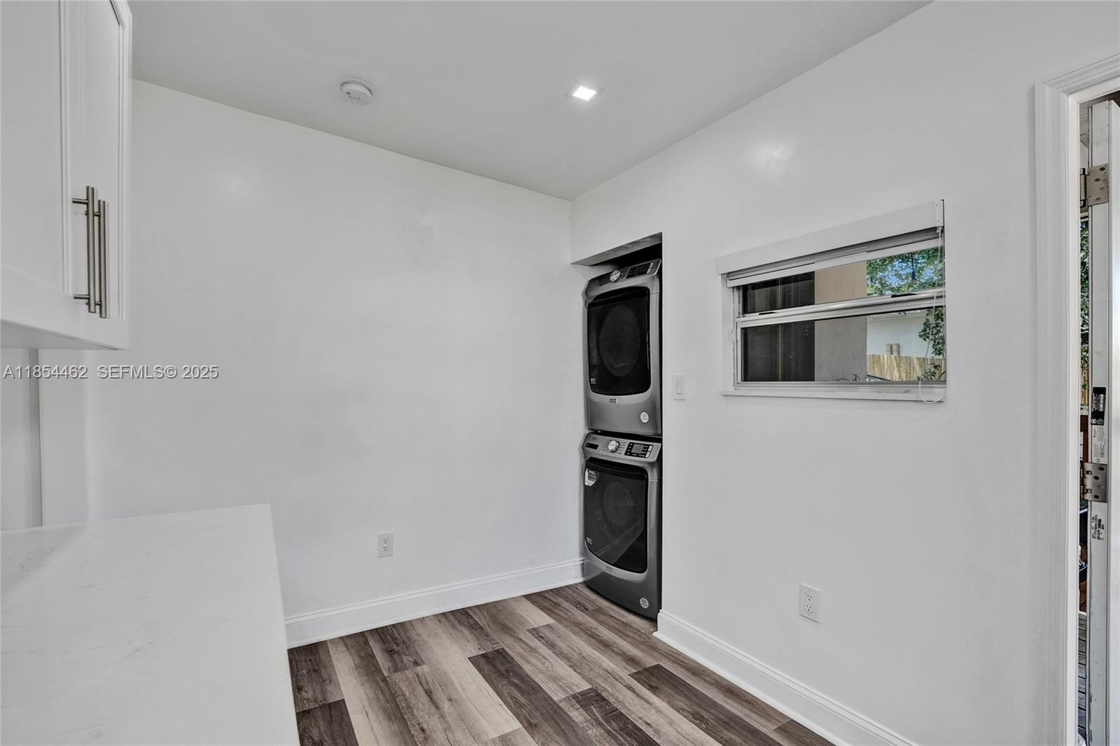 2137 Southwest 4th Street Miami, FL 33135 - Photo 20 of 27 a view of kitchen with wooden floor and white wall