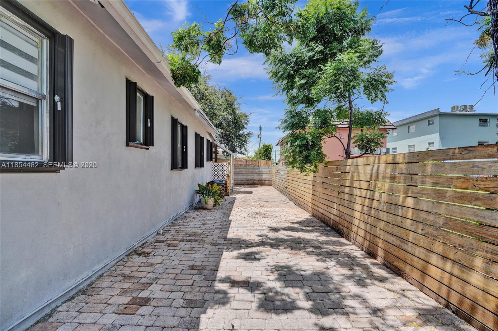 2137 Southwest 4th Street Miami, FL 33135 - Photo 23 of 27 a pathway of a house with a yard