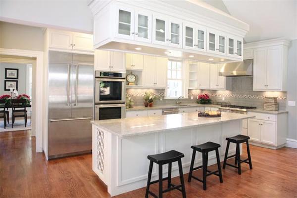 116 Oxford Road Newton, MA 02459 - Photo 4 of 9 a kitchen with cabinets and stainless steel appliances