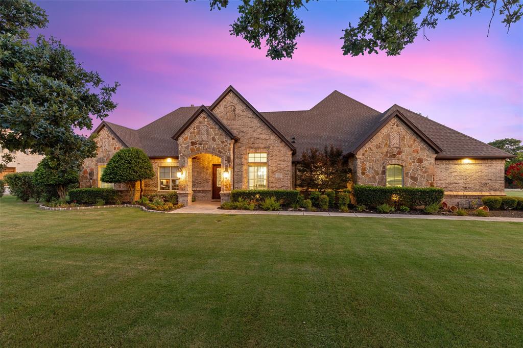 700 Frenchtown Road Argyle, TX 76226 - Photo 1 of 1 a front view of a house with a garden and porch