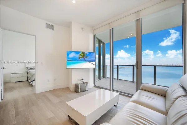 a view of kitchen with cabinets and wooden floor