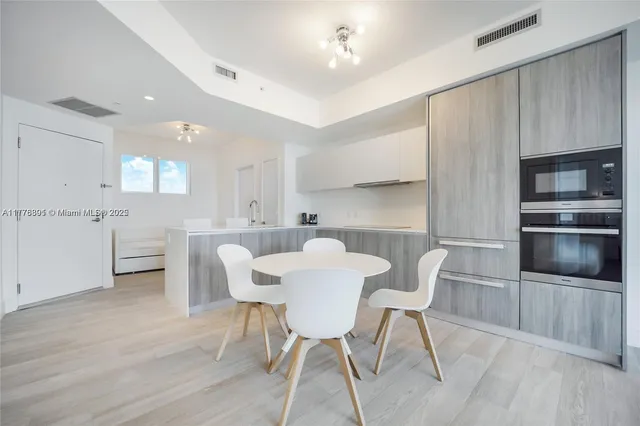 a bedroom with a bed and a chair