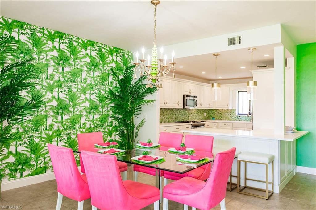 22 Cypress View Drive, Unit B22 Naples, FL 34113 - Photo 11 of 39 a view of kitchen with furniture and chandelier