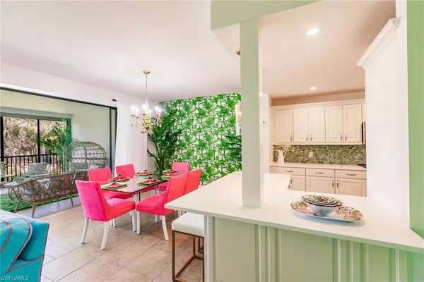 a dining room with furniture and window