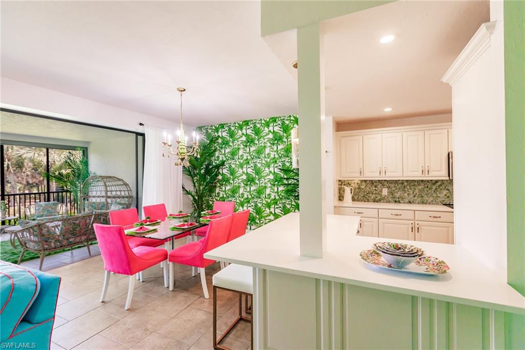22 Cypress View Drive, Unit B22 Naples, FL 34113 - Photo 13 of 39 a dining room with furniture and window