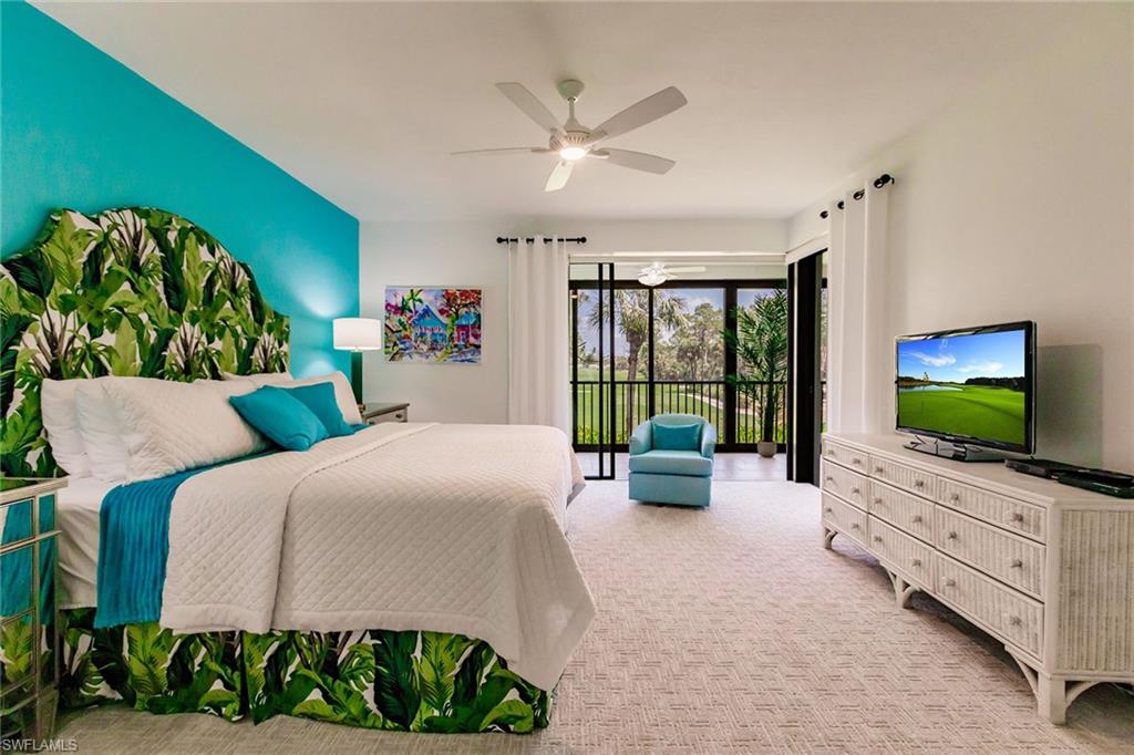 22 Cypress View Drive, Unit B22 Naples, FL 34113 - Photo 20 of 39 a living room with furniture and a flat screen tv