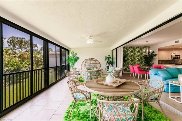 a view of a dining room with furniture window and outside view