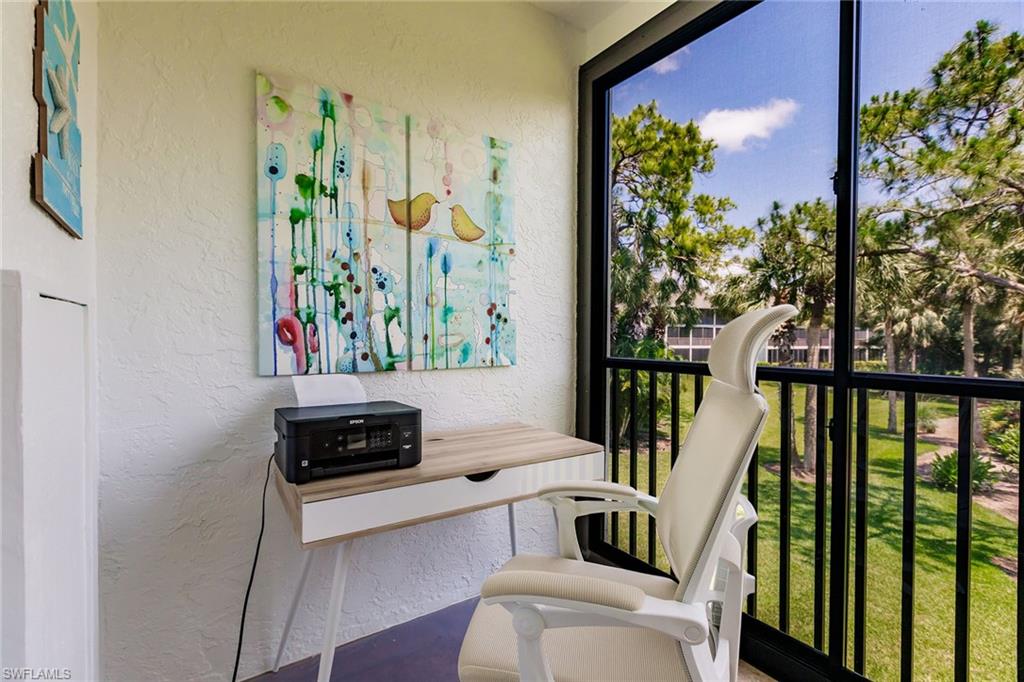 22 Cypress View Drive, Unit B22 Naples, FL 34113 - Photo 34 of 39 a bedroom with furniture and a window
