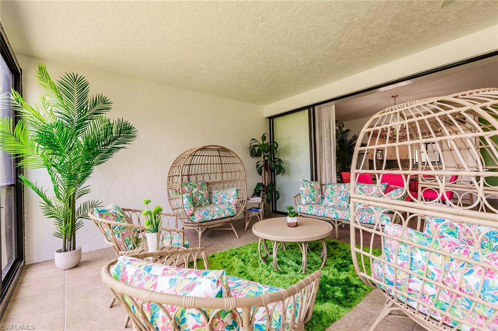 22 Cypress View Drive, Unit B22 Naples, FL 34113 - Photo 35 of 39 a view of a swimming pool with outdoor seating