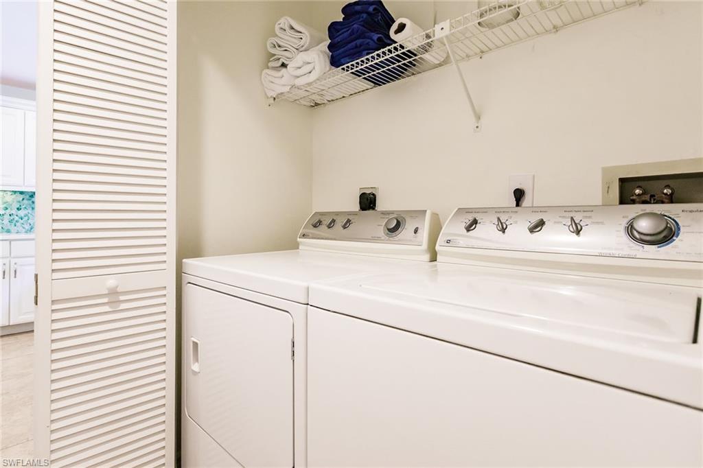 22 Cypress View Drive, Unit B22 Naples, FL 34113 - Photo 37 of 39 a utility room with dryer and washer