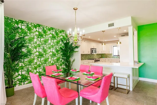 a dining room with a table and chairs
