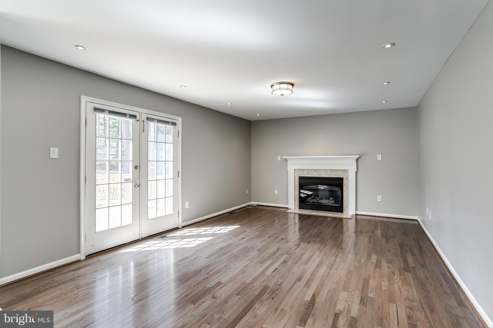 6260 Martin Road Columbia, MD 21044 - Photo 10 of 34 Family Room with Fireplace & Deck Access