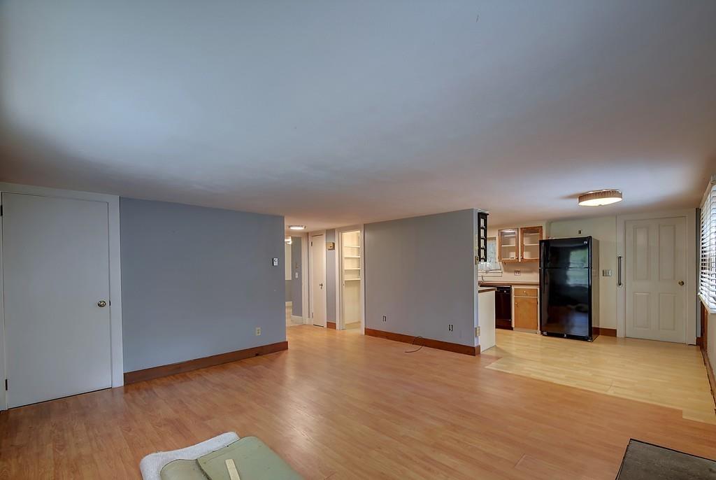 96 Shepard Road Sturbridge, MA 01566 - Photo 18 of 28 a view of a big room with wooden floor and a kitchen