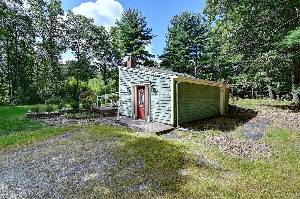 96 Shepard Road Sturbridge, MA 01566 - Photo 5 of 28 a view of a house with backyard and trees