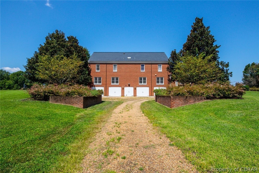 19607 White Oak Road Sutherland, VA 23885 - Photo 38 of 50 Rear view of carriage house, 4 car parking on 1st level and living space on 2nd. Basement (rear access offers 4 car parking) Double door entry.