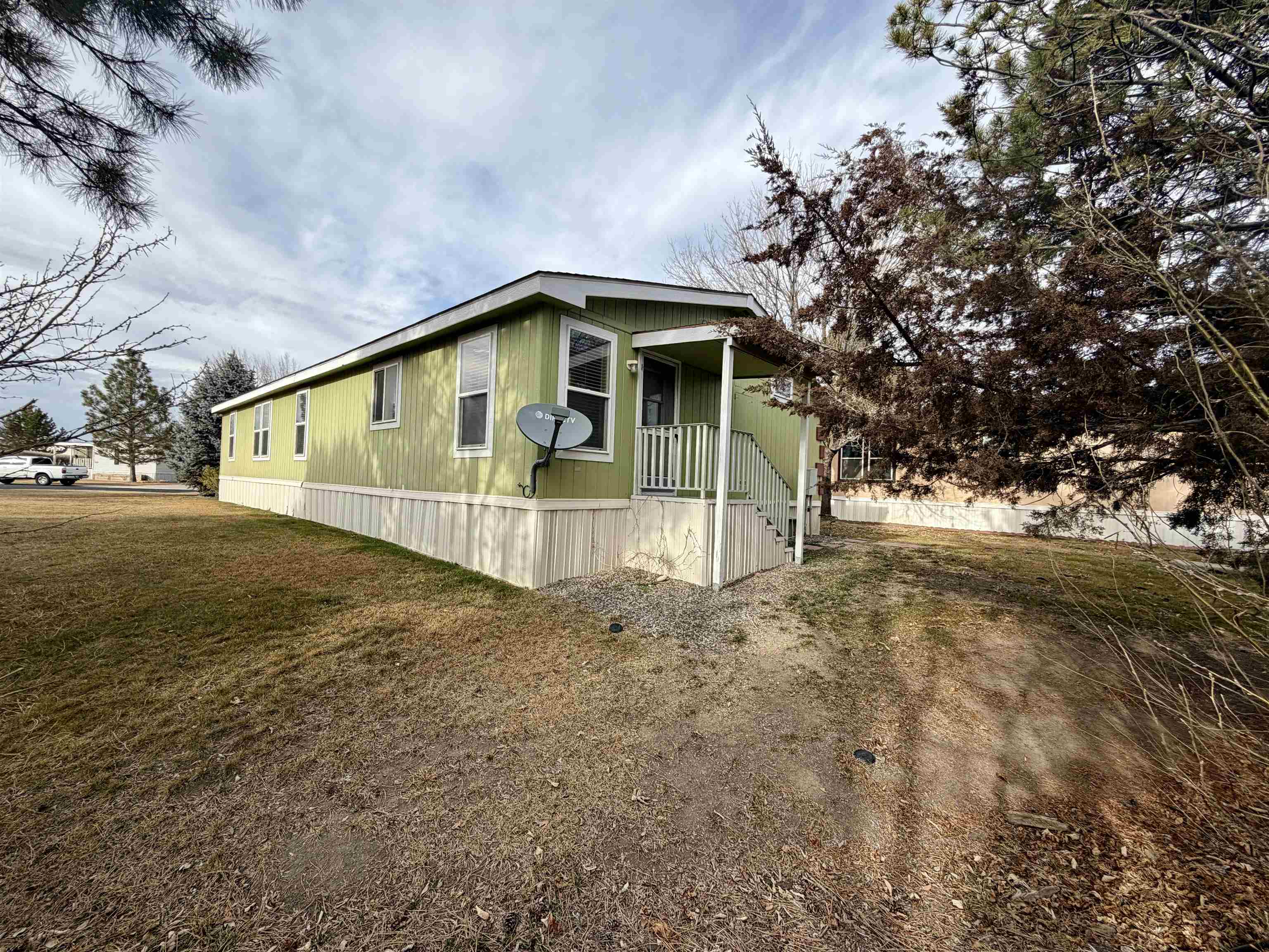 435 32 Road, Unit 480 Clifton, CO 81520 - Photo 21 of 23 a view of a house with a yard