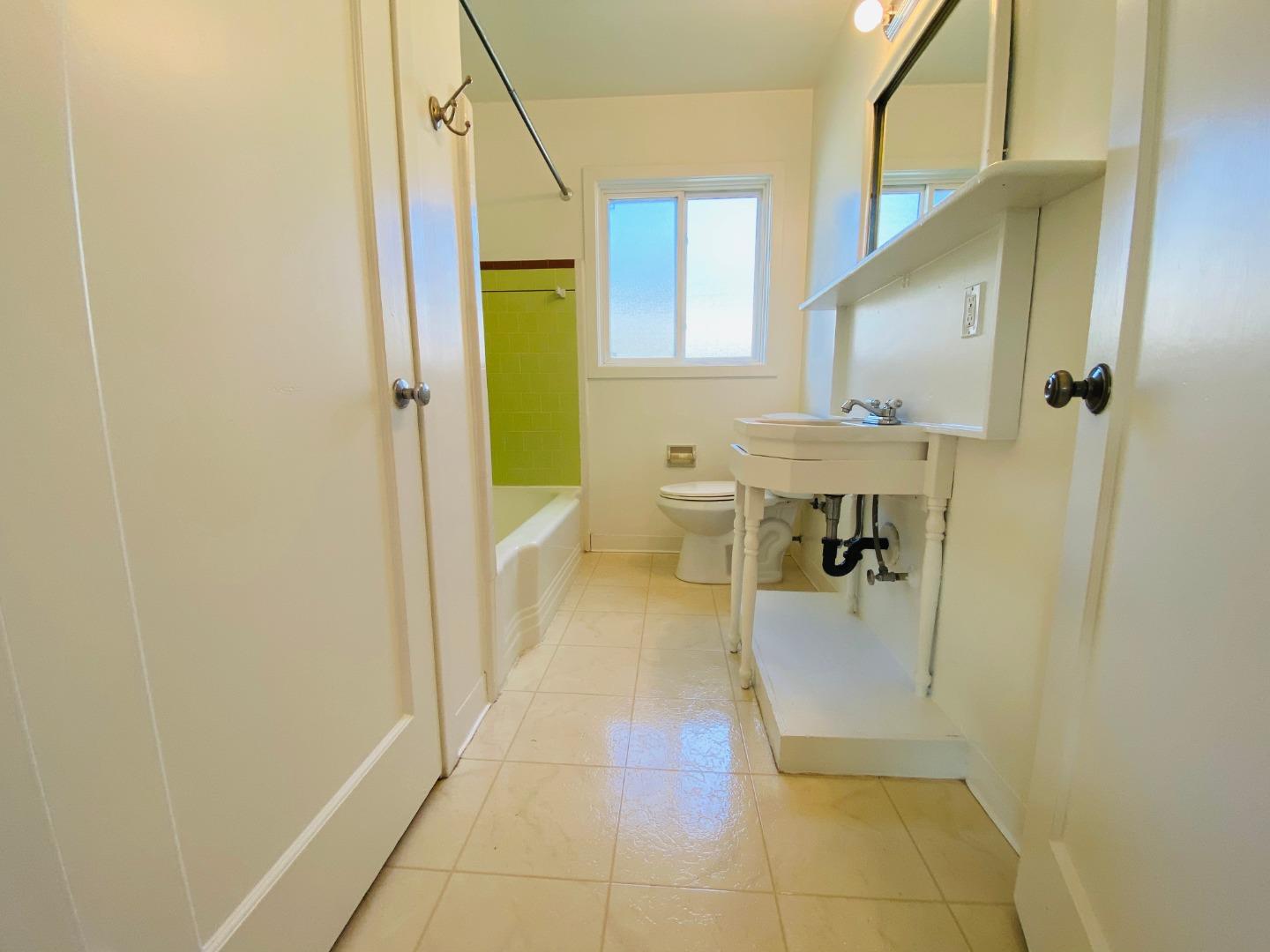 15107 Woodard Road San Jose, CA 95124 - Photo 13 of 20 a bathroom with a sink a toilet and shower