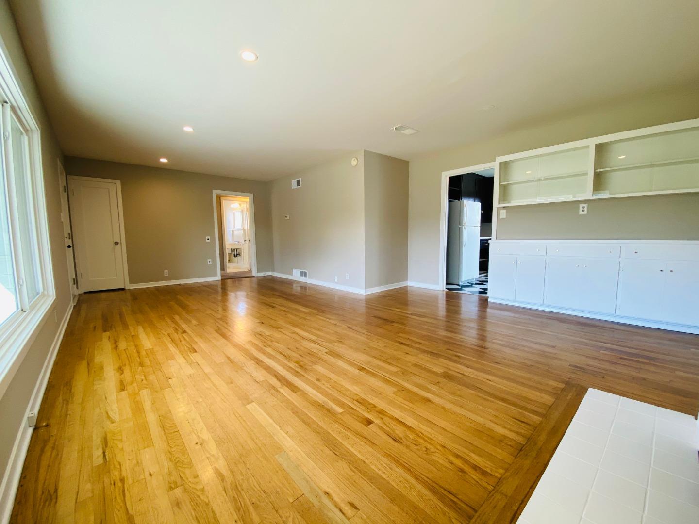 15107 Woodard Road San Jose, CA 95124 - Photo 3 of 20 a view of an empty room with wooden floor