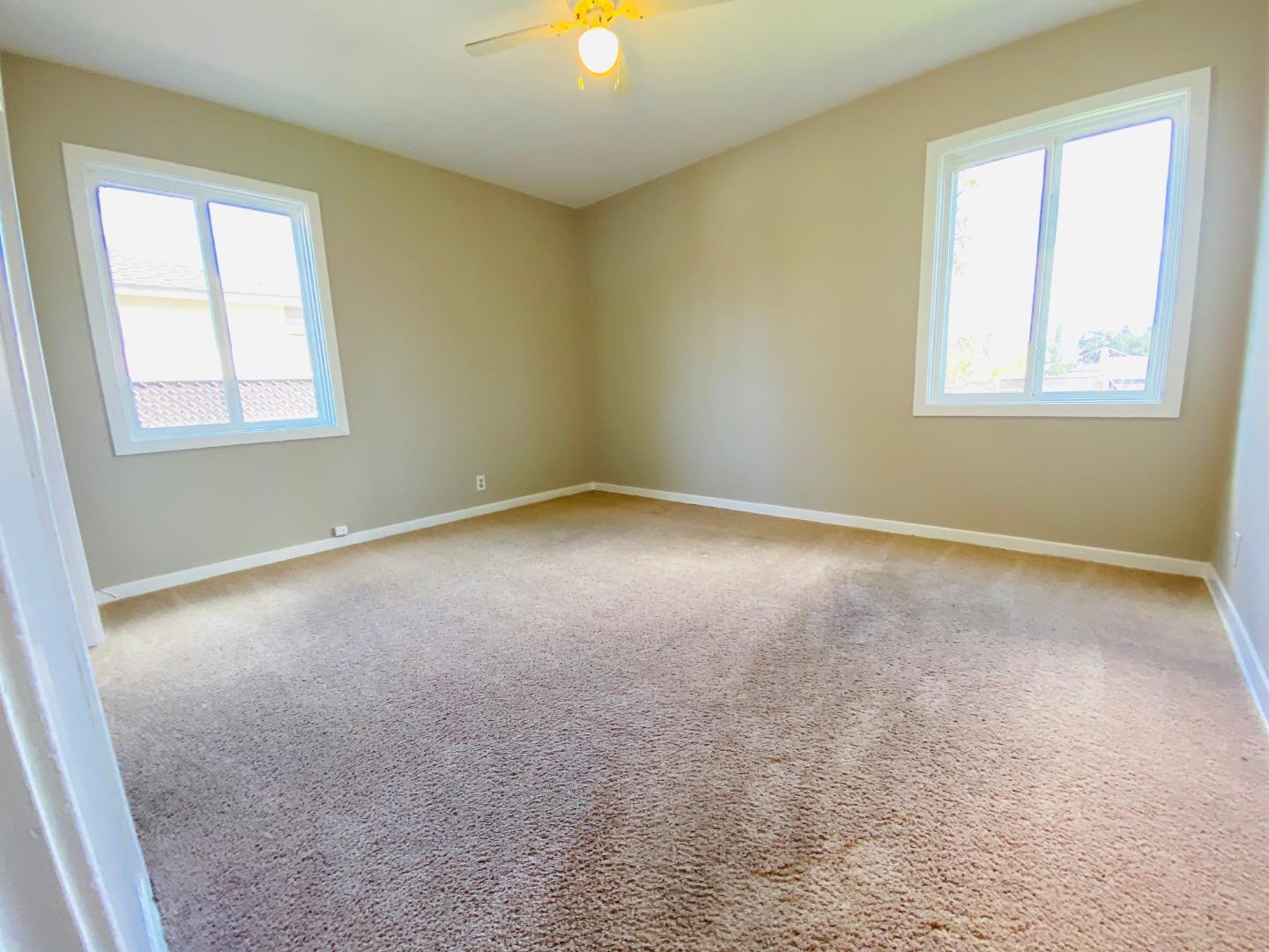 15107 Woodard Road San Jose, CA 95124 - Photo 10 of 20 an empty room with windows and closet