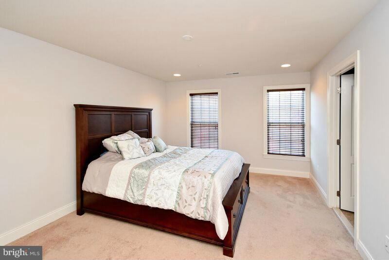 7616 Elmcrest Road Hanover, MD 21076 - Photo 15 of 30 a bedroom with a bed and window