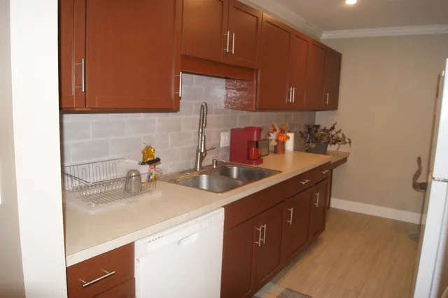 a kitchen with a sink and cabinets