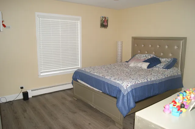 a living room with kitchen island furniture and a window