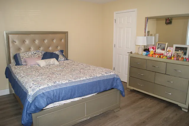 a bedroom with a bed and window