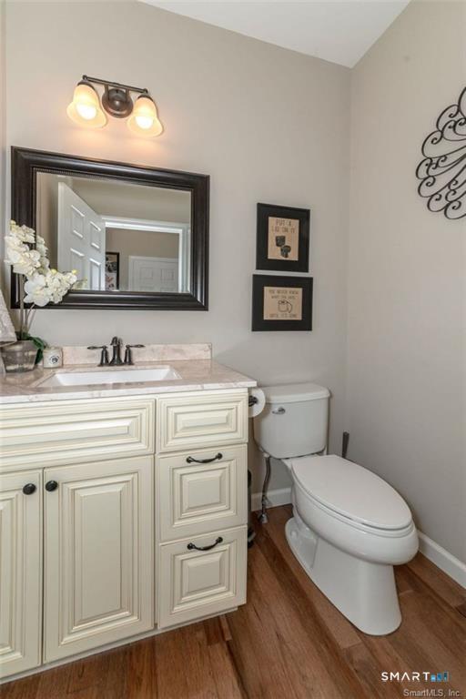 823 A Stone Road Windsor, CT 06095 - Photo 7 of 38 a bathroom with a toilet sink and mirror