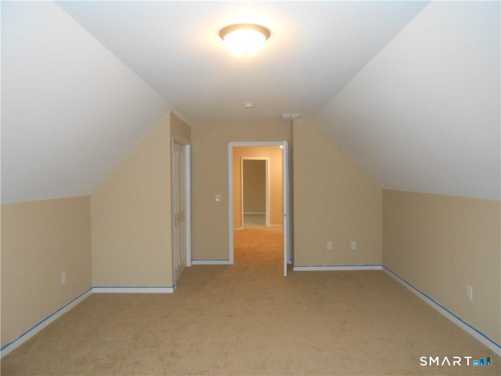 823 A Stone Road Windsor, CT 06095 - Photo 14 of 38 an empty room with a empty space and windows