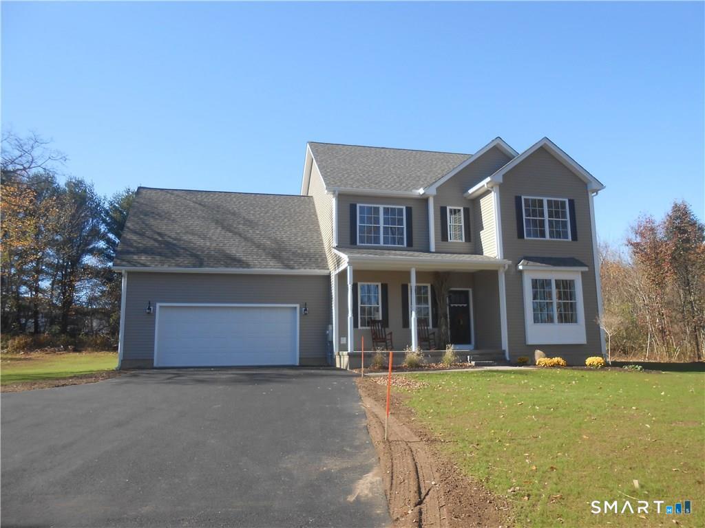 823 A Stone Road Windsor, CT 06095 - Photo 2 of 38 a front view of a house with a yard and garage