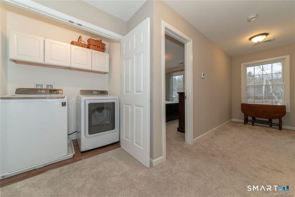 823 A Stone Road Windsor, CT 06095 - Photo 18 of 38 a view of a kitchen with a sink cabinets and a window