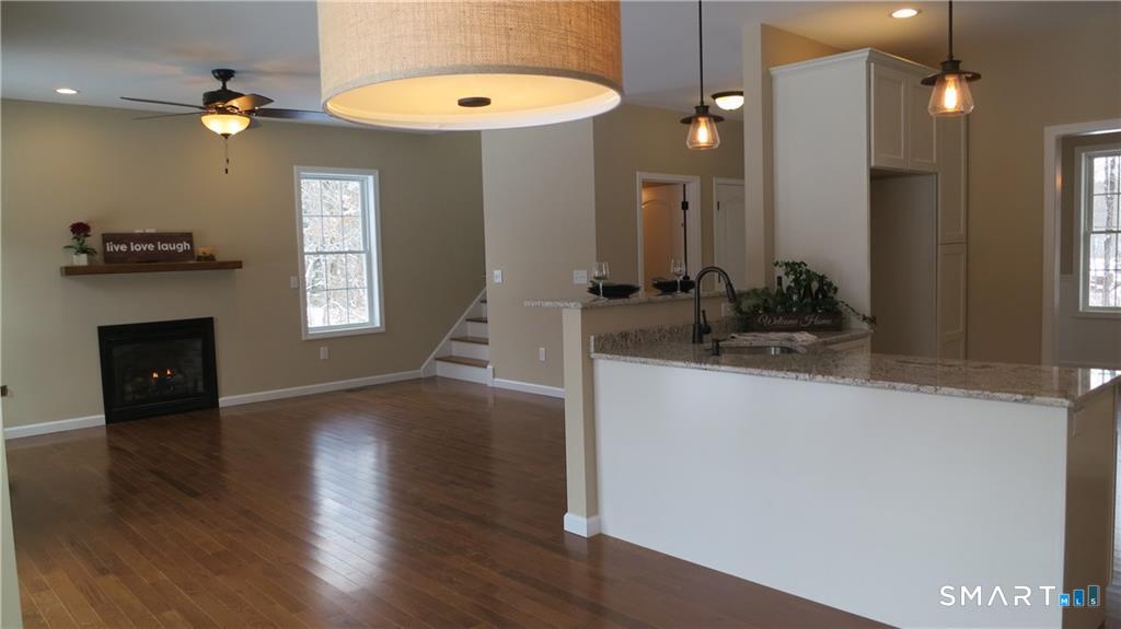 823 A Stone Road Windsor, CT 06095 - Photo 20 of 38 a view of livingroom with furniture and wooden floor