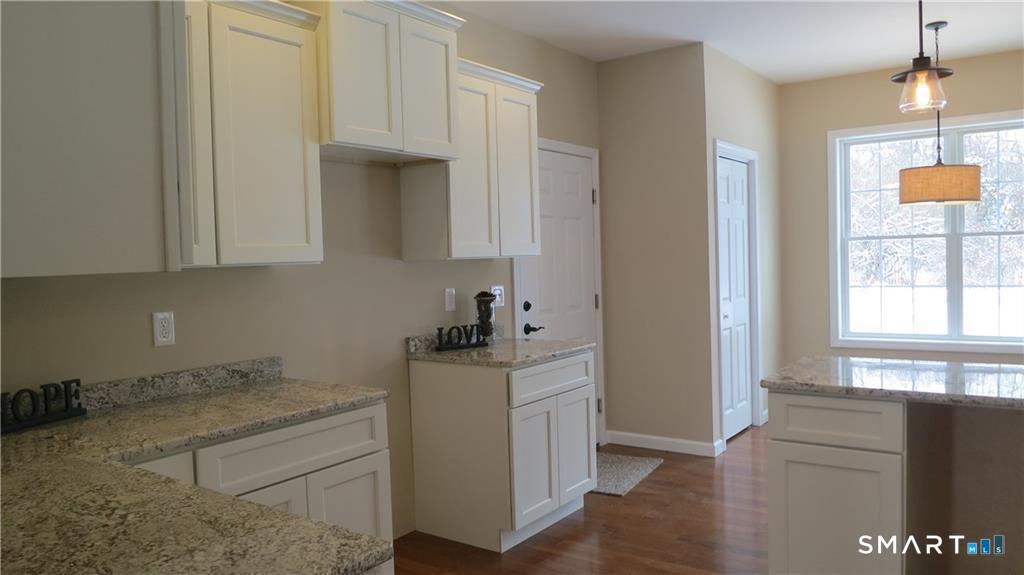 823 A Stone Road Windsor, CT 06095 - Photo 21 of 38 a kitchen with a sink and cabinets