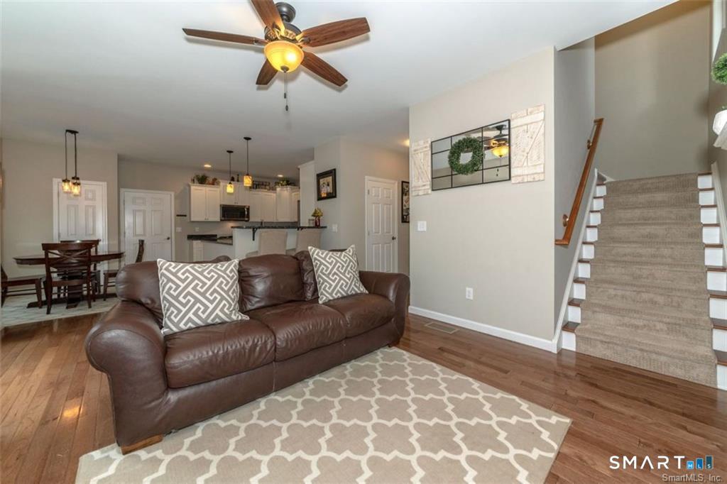 823 A Stone Road Windsor, CT 06095 - Photo 23 of 38 a living room with furniture and a rug